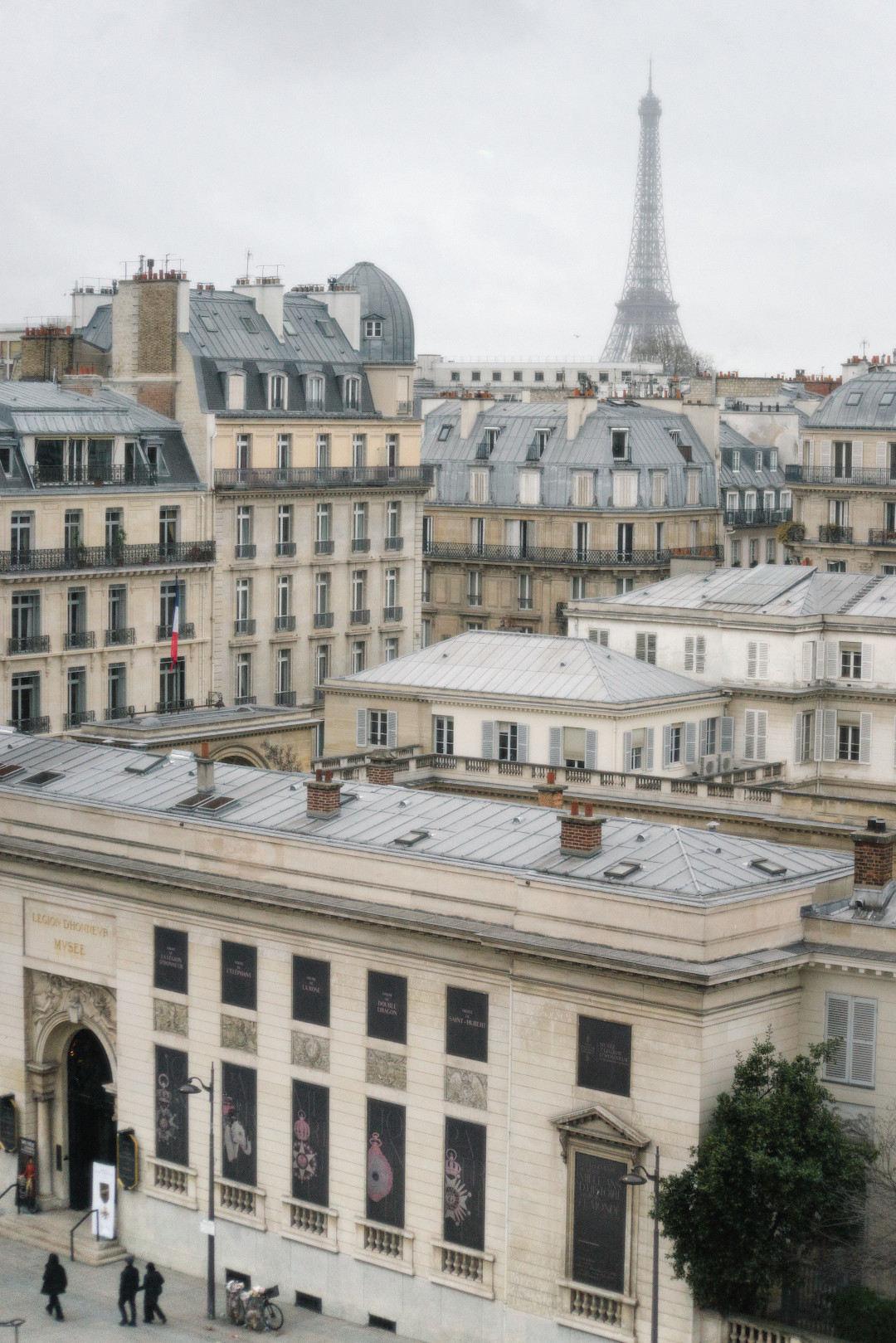 The Eiffel Tower rising above buildings